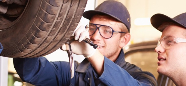 Technicians-Working-On-Tire
