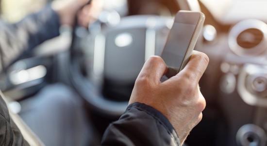 Driver-Checking-Smartphone