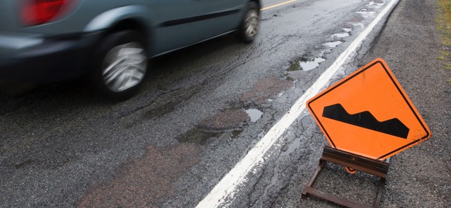 Car-With-Bumpy-Road-Sign