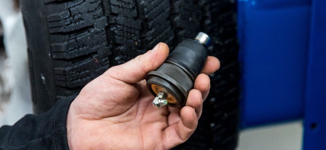 Mechanic-Holding-Ball-Joint