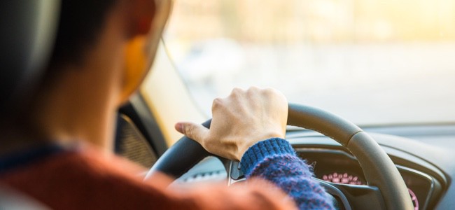 Female-Driver-With-Hands-On-Steering-Wheel