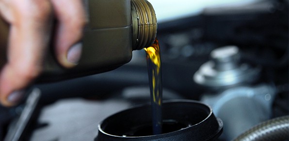 Oil-Being-Poured-In-Car-Engine
